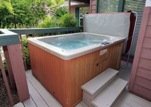 A hot tub on the deck of a Gatlinburg cabin rental at Chalet Village.