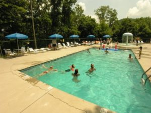 Guests swimming at the Upper Alpine Clubhouse pool.