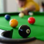 Closeup photo of a pool table.