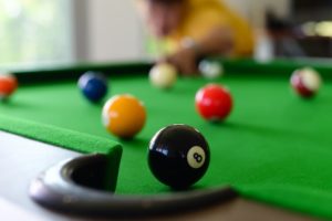 Closeup photo of a pool table.