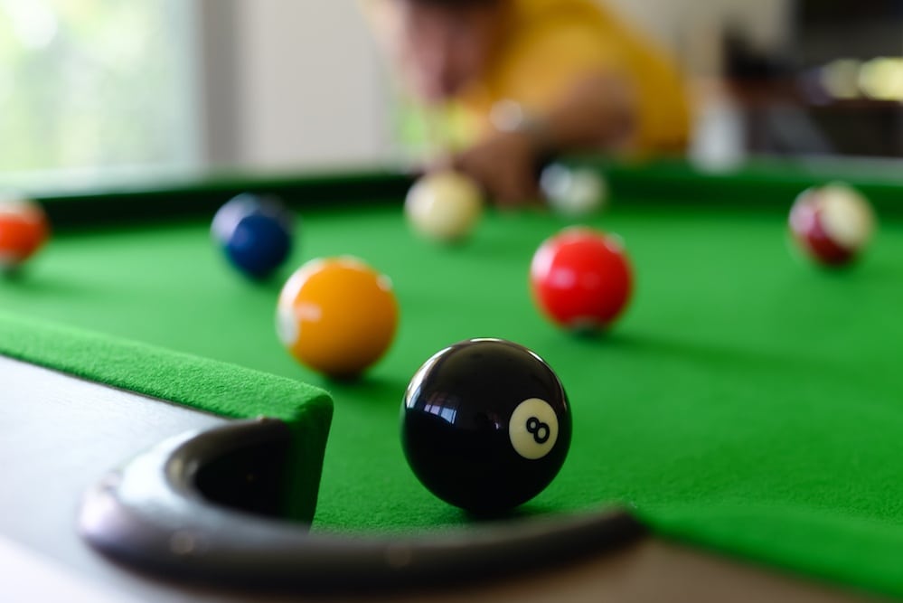 Closeup photo of a pool table.