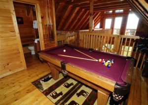 The loft of a Gatlinburg cabin rental with pool table.
