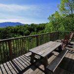 The deck of a Gatlinburg cabin with mountain views.
