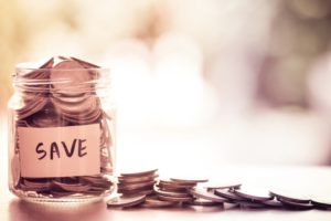 coins in a jar and on table