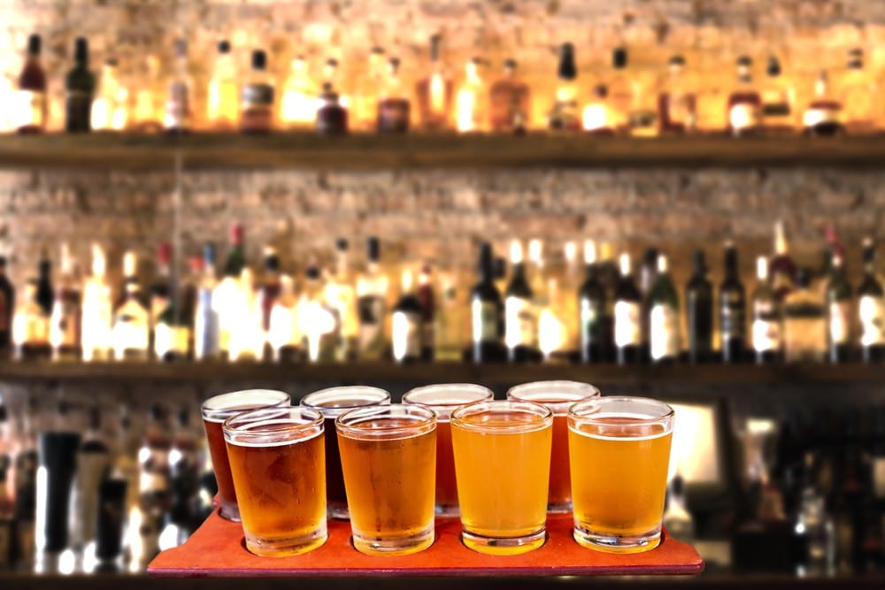 beer flights in front of a bar