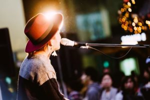 woman singing to a crowd