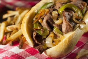 cheesesteak sandwich and french fries