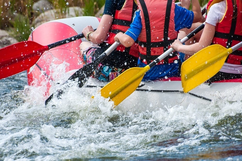 people white water rafting in the smoky mountains